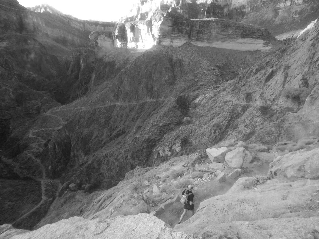 Matt Neukich descending Bright Angel Trail. Devil's Corkscrew switchbacks in the background